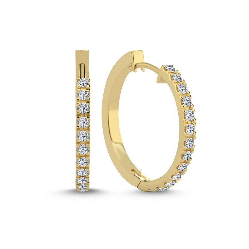 Nuran creoler i 14 karat guld med 0,52 ct hvide diamanter Ø23 mm.